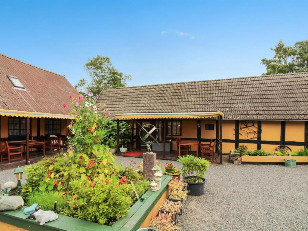 a building with a garden in front of it at Apartment Annamia - 250m from the sea by Interhome in Neksø