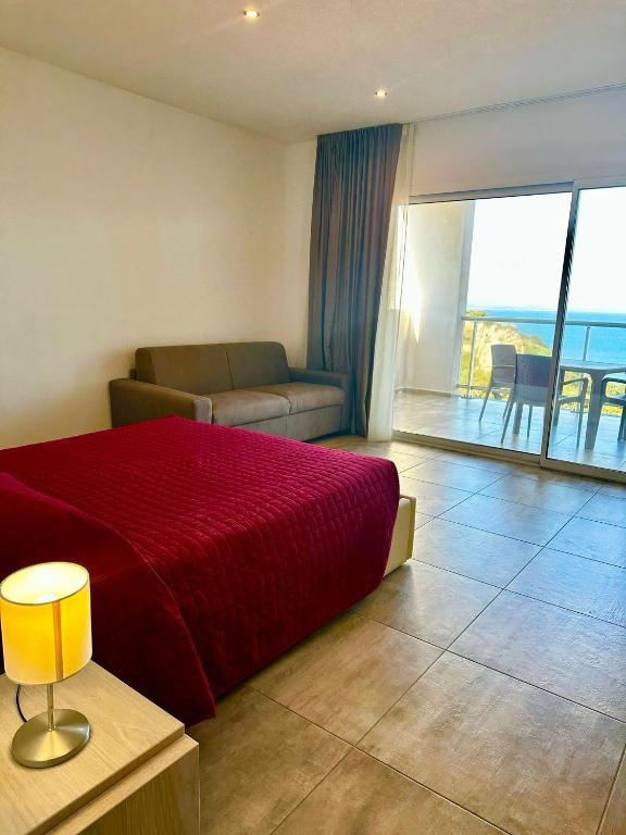 Postel nebo postele na pokoji v ubytování Hotel La Contessa