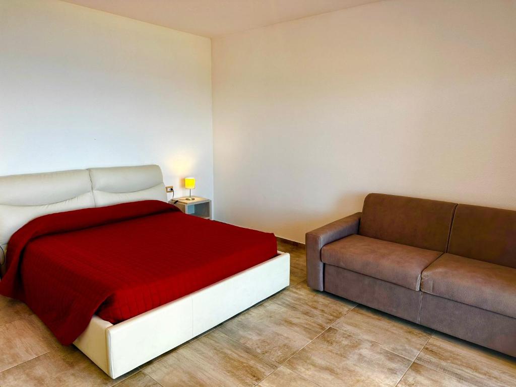 Postel nebo postele na pokoji v ubytování Hotel La Contessa
