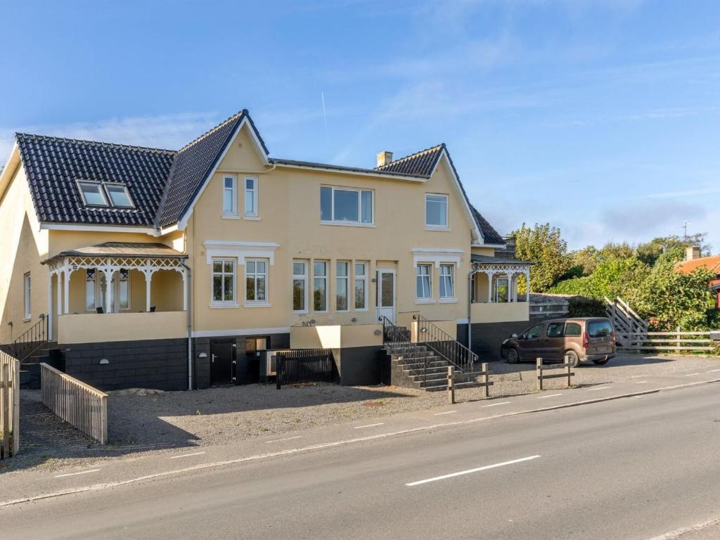a large house on the side of a road at Apartment Reinhardt - 100m from the sea in Bornholm by Interhome in Allinge
