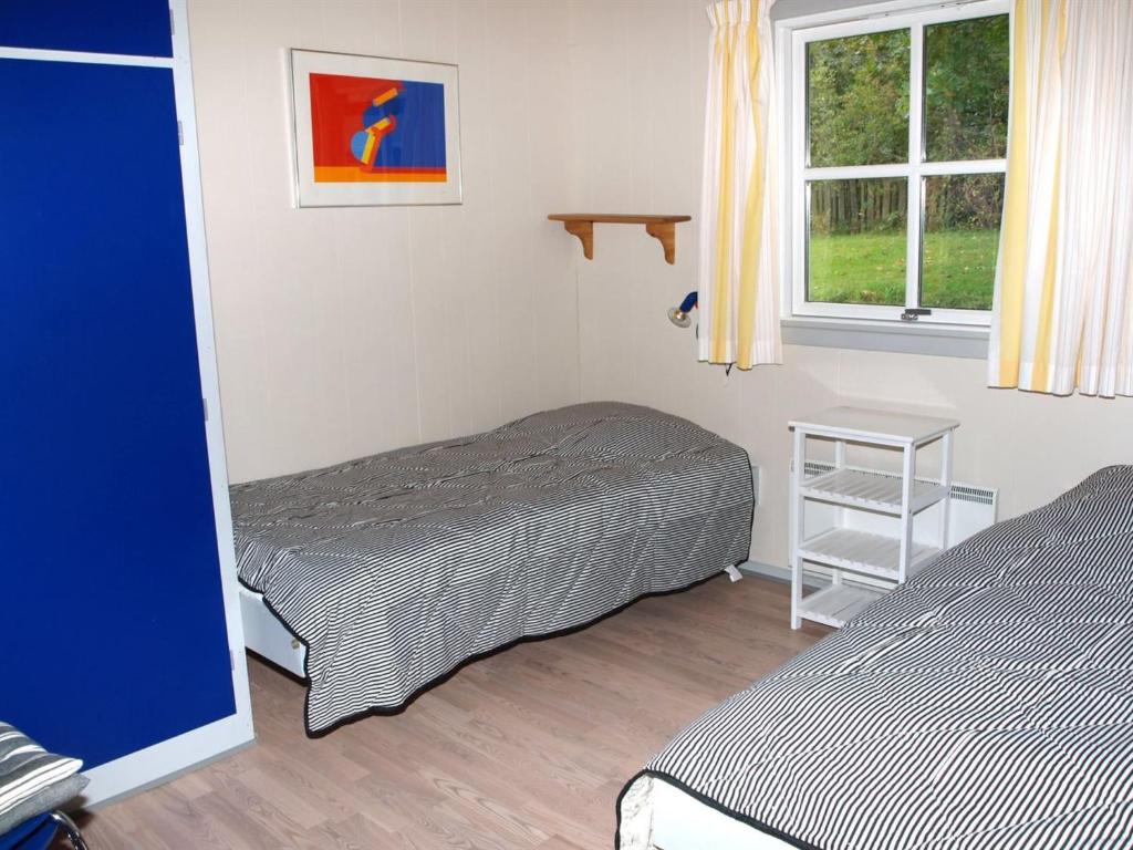 Postel nebo postele na pokoji v ubytování Holiday Home Iikka - 300m from the sea by Interhome