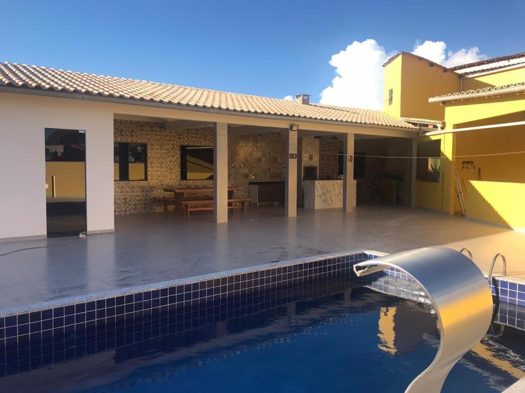 a house with a pool in front of it at Casa Diamantina in Ibicoara