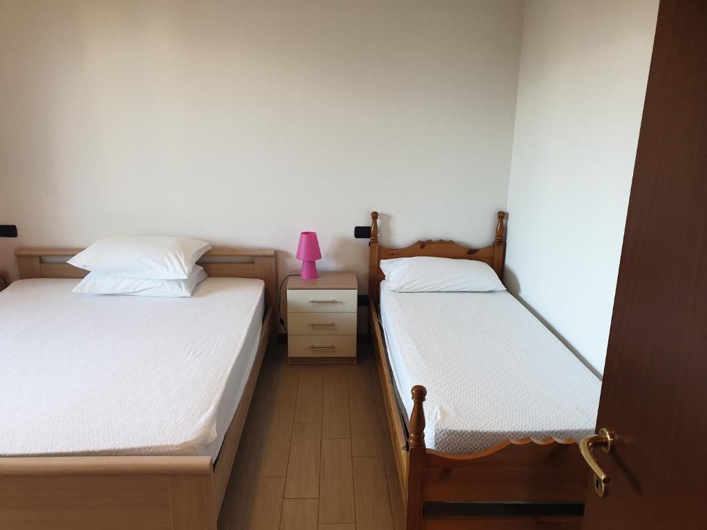 Postel nebo postele na pokoji v ubytování CASA VACANZE DA RIKI