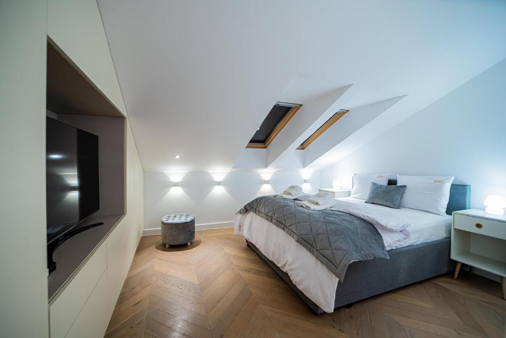 Posteľ alebo postele v izbe v ubytovaní Apartamenty Rynek 7 by Hotel Żywiecki****