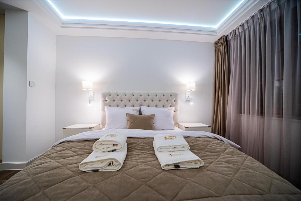 Posteľ alebo postele v izbe v ubytovaní Apartamenty Rynek 7 by Hotel Żywiecki****