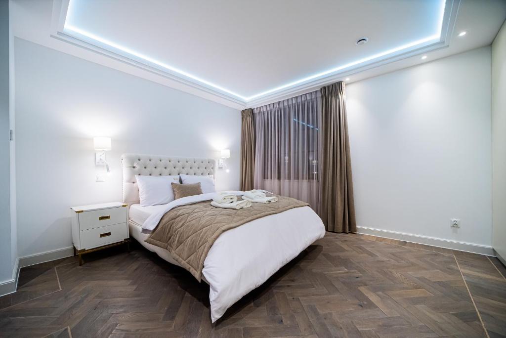 Posteľ alebo postele v izbe v ubytovaní Apartamenty Rynek 7 by Hotel Żywiecki****