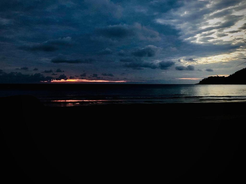 a view of the ocean with a cloudy sky at Tiongman Scubadive & Lodge in Tioman Island