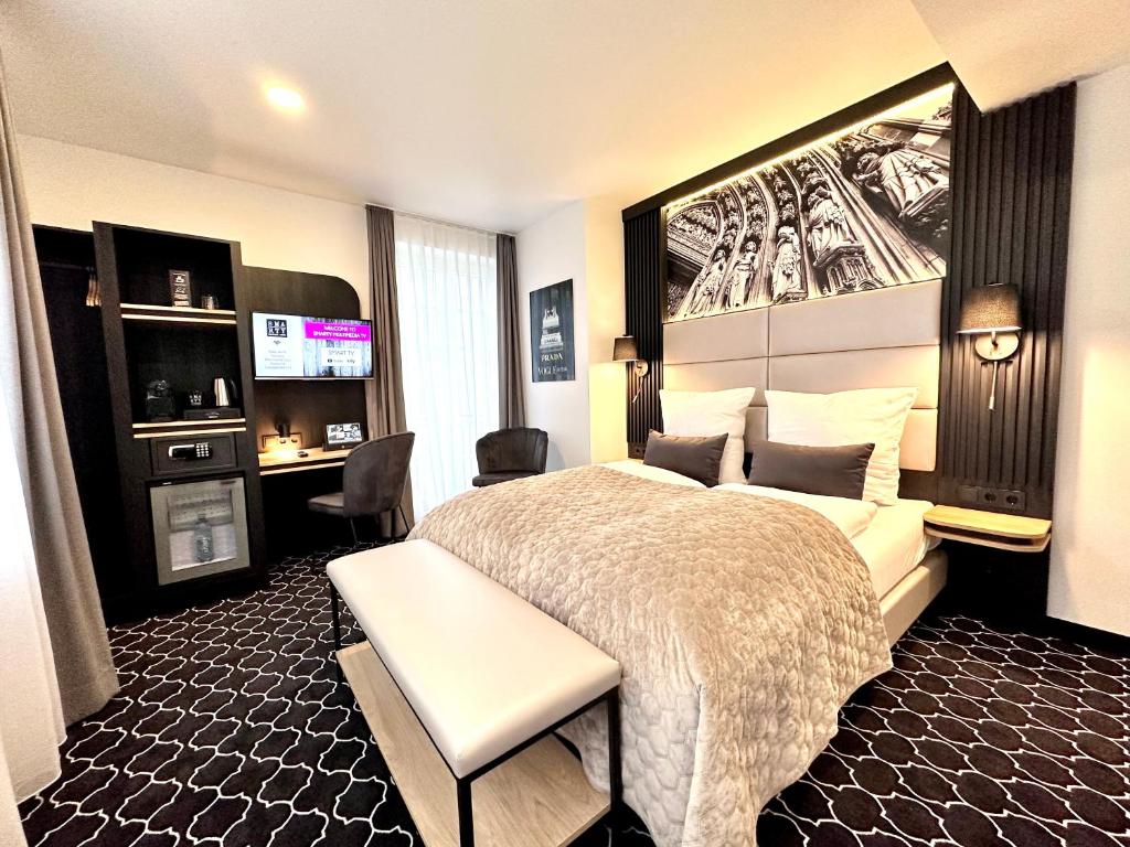 Ένα ή περισσότερα κρεβάτια σε δωμάτιο στο Rhein Hotel St. Martin