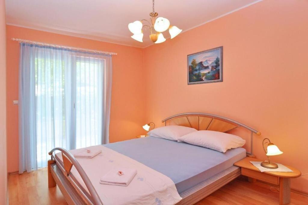 Postel nebo postele na pokoji v ubytování Apartment Steli