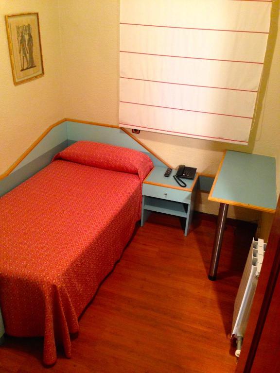 Postel nebo postele na pokoji v ubytování Hotel Pelayo