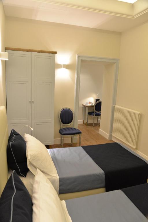 Кровать или кровати в номере Little Rose Residence