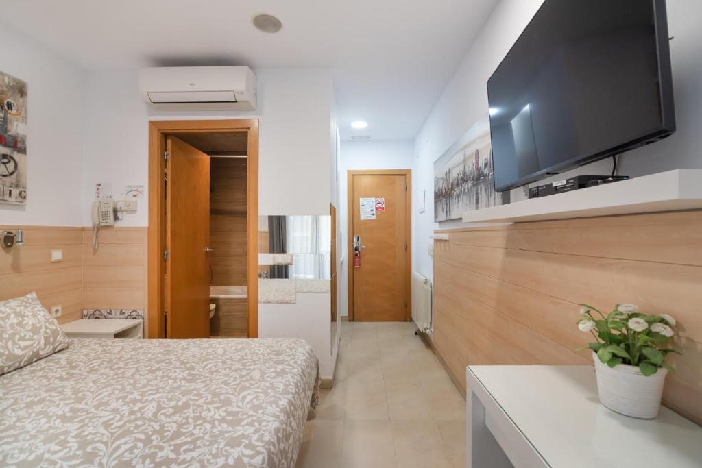 Posteľ alebo postele v izbe v ubytovaní Hostal House