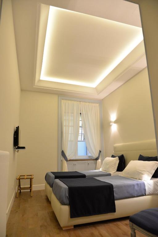 Кровать или кровати в номере Little Rose Residence