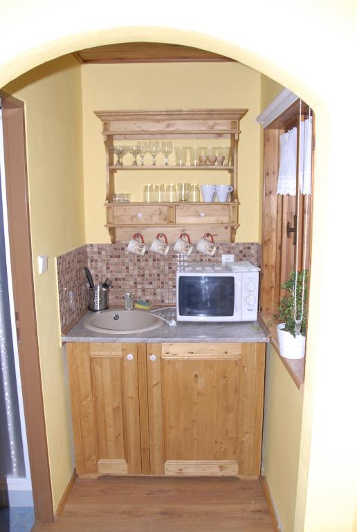 Kuchyň nebo kuchyňský kout v ubytování Pension Cortina