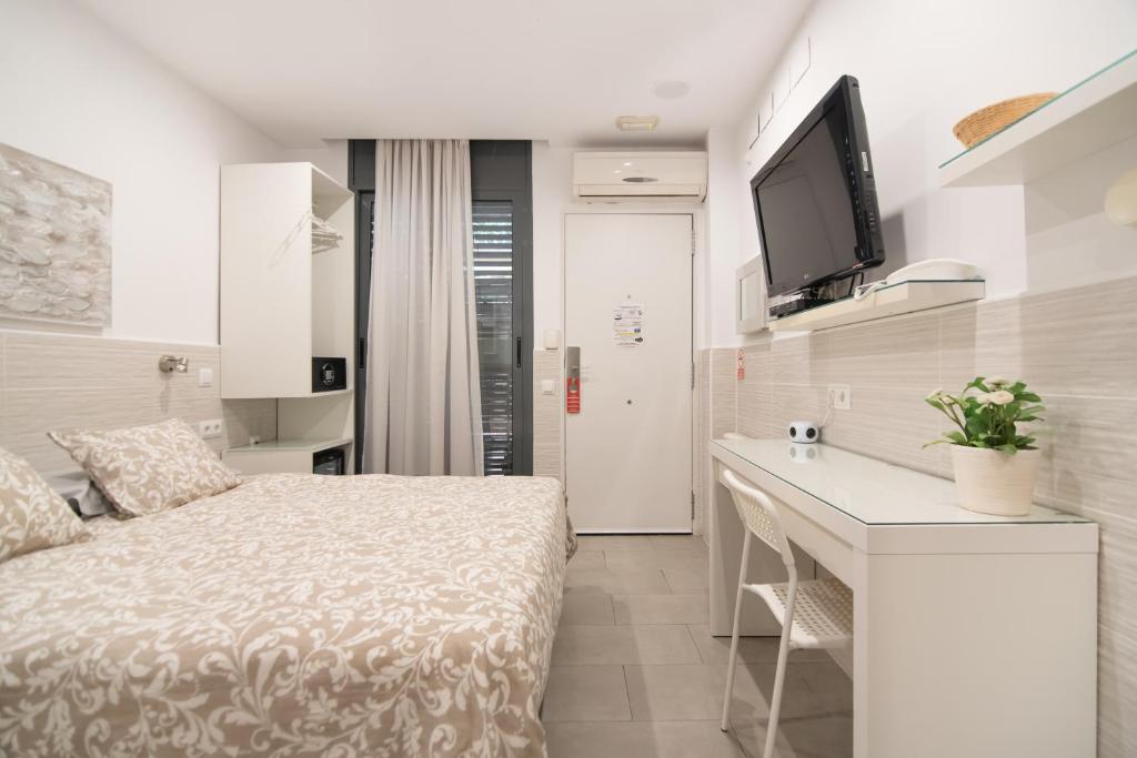Posteľ alebo postele v izbe v ubytovaní Hostal House