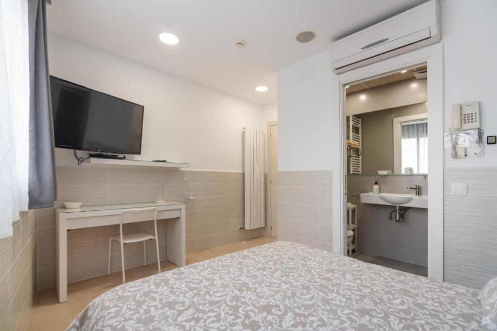 Posteľ alebo postele v izbe v ubytovaní Hostal House