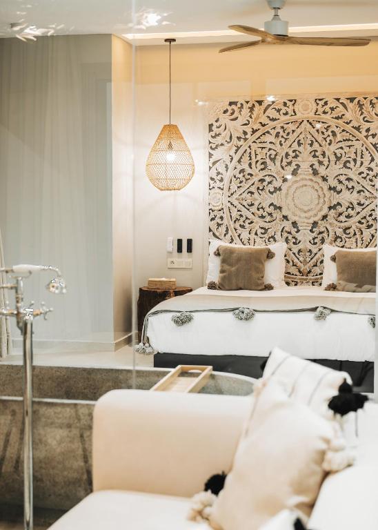 a bedroom with a bed and a couch in a room at Tulum Beach Resort Dakhla in Dakhla