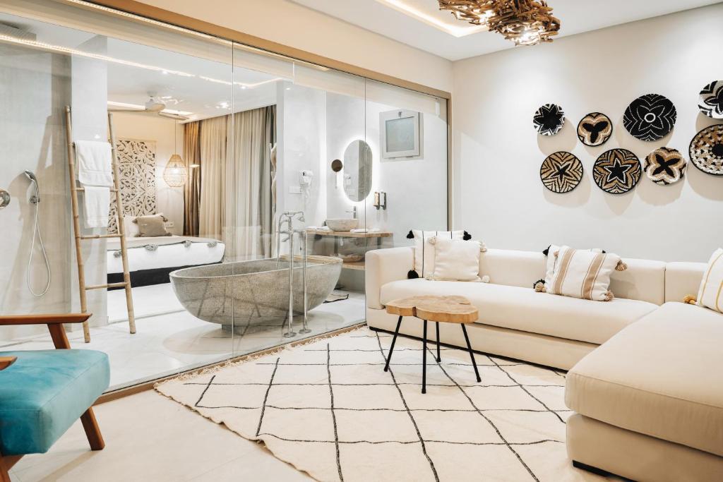 a living room with a couch and a bathroom at Tulum Beach Resort Dakhla in Dakhla