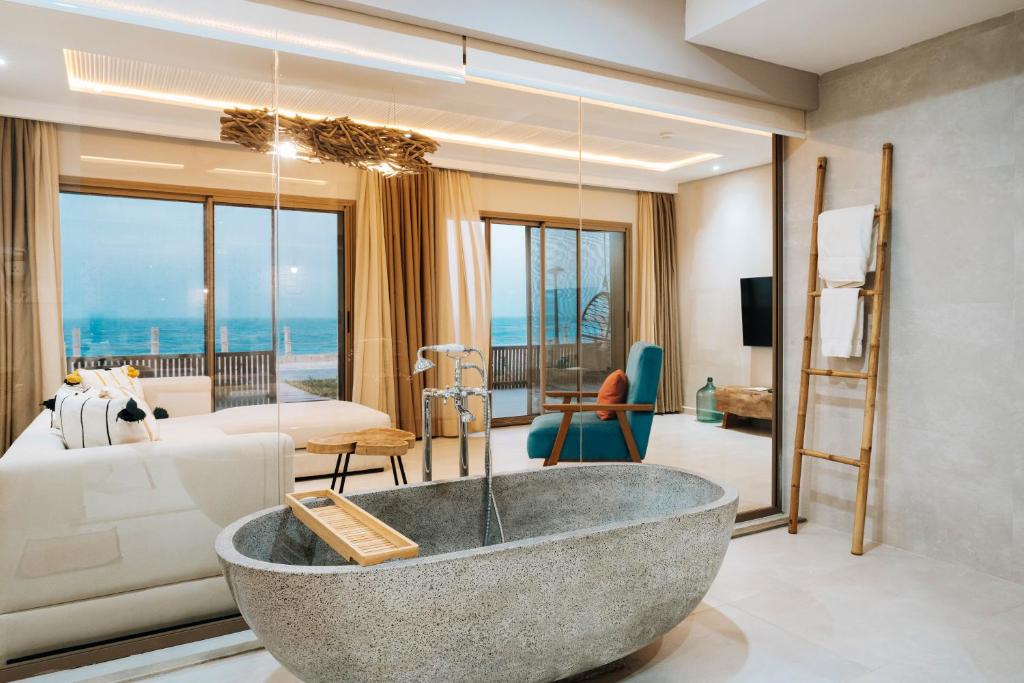 a living room with a tub in the middle of a room at Tulum Beach Resort Dakhla in Dakhla