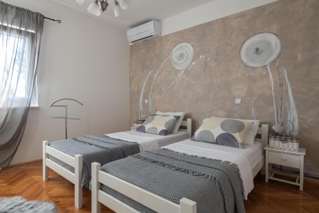 Postel nebo postele na pokoji v ubytování Villa Daniel