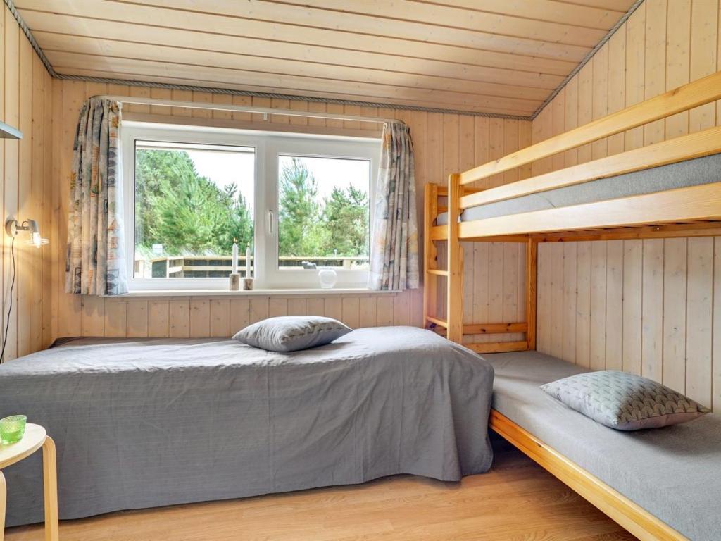 Postel nebo postele na pokoji v ubytování Holiday Home Ivar - 900m from the sea by Interhome