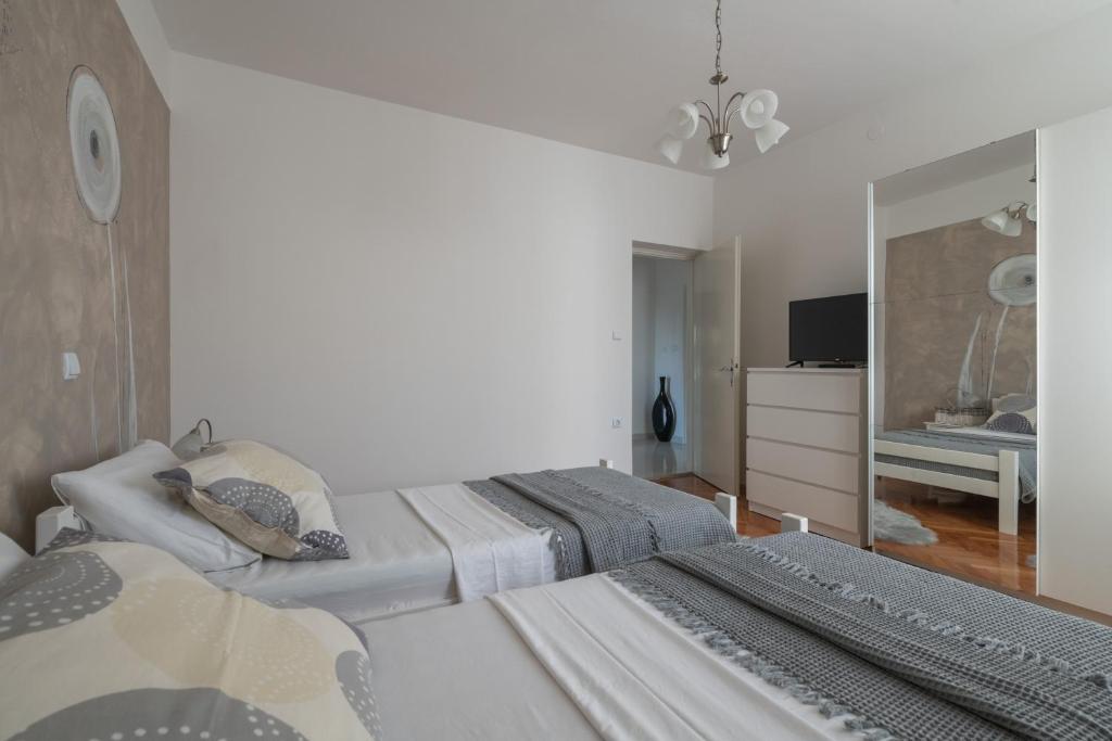 Postel nebo postele na pokoji v ubytování Villa Daniel