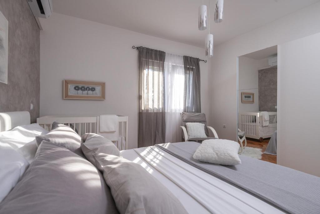 Postel nebo postele na pokoji v ubytování Villa Daniel