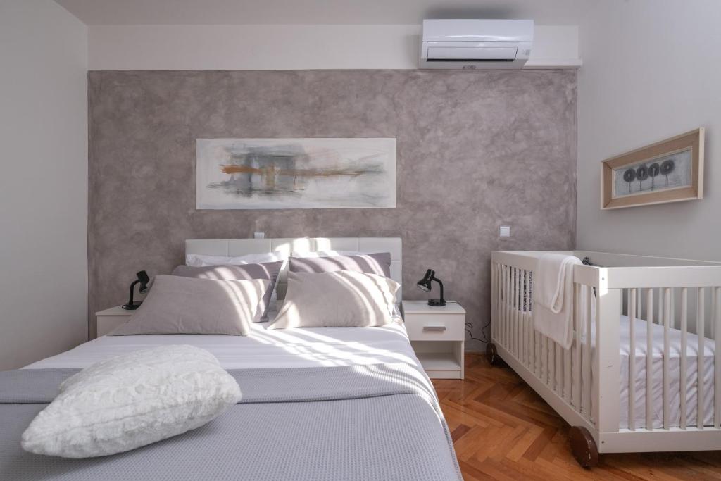 Postel nebo postele na pokoji v ubytování Villa Daniel