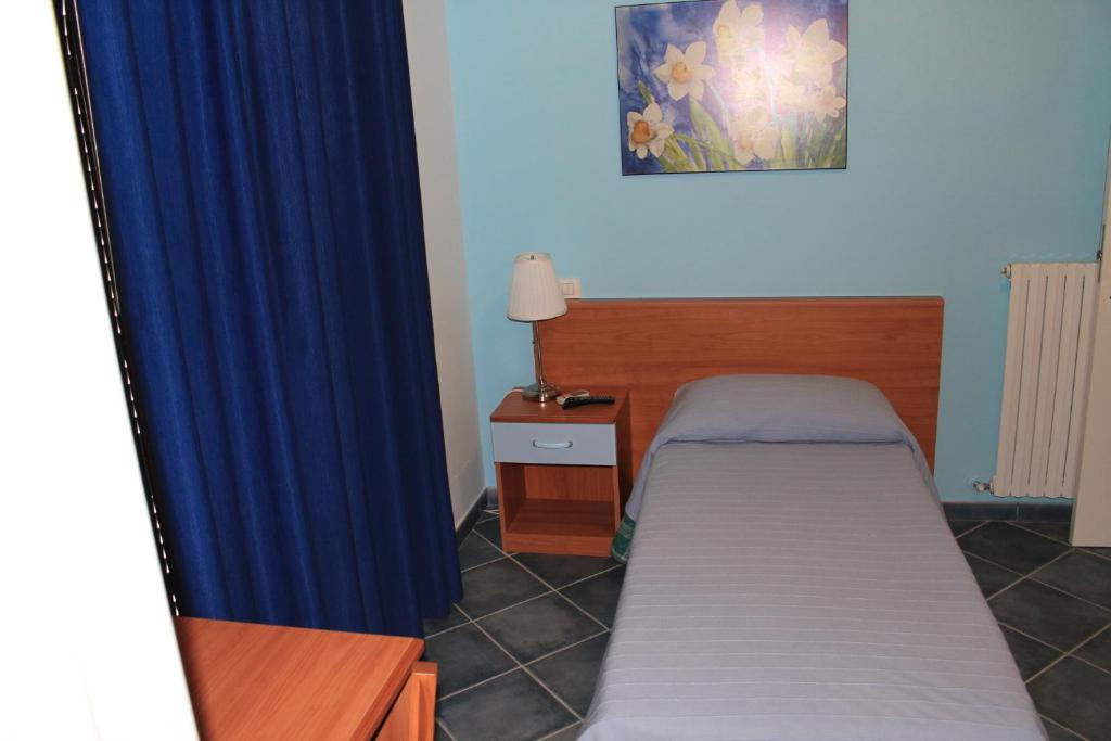 Postel nebo postele na pokoji v ubytování La Piazzetta Affittacamere B&B