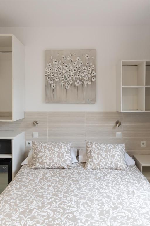 Posteľ alebo postele v izbe v ubytovaní Hostal House