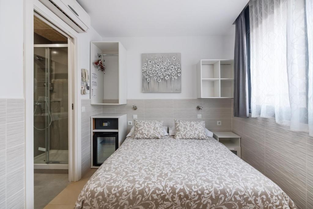 Posteľ alebo postele v izbe v ubytovaní Hostal House