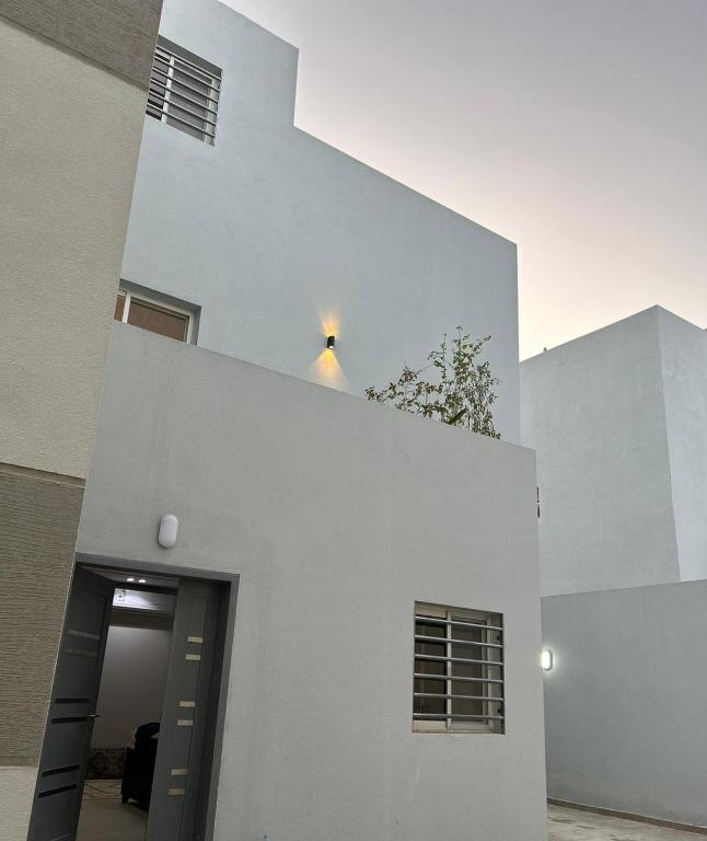 a white building with a doorway in front of it at Riyadh Salman Villa فيلا in Riyadh
