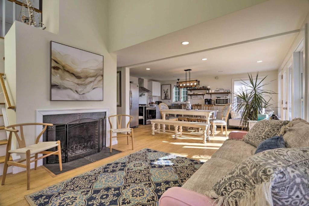 a living room with a couch and a fireplace at Rhode Island Retreat with Kayaks, Deck and Pond Access in South Kingstown