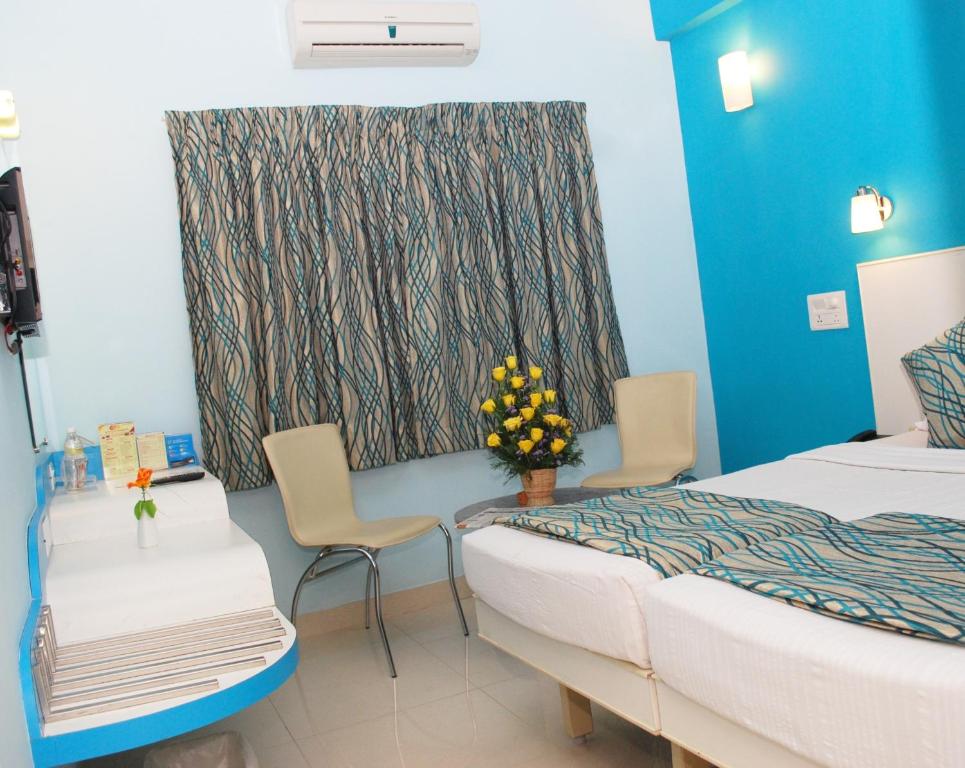 Postel nebo postele na pokoji v ubytování Hotel Pandian