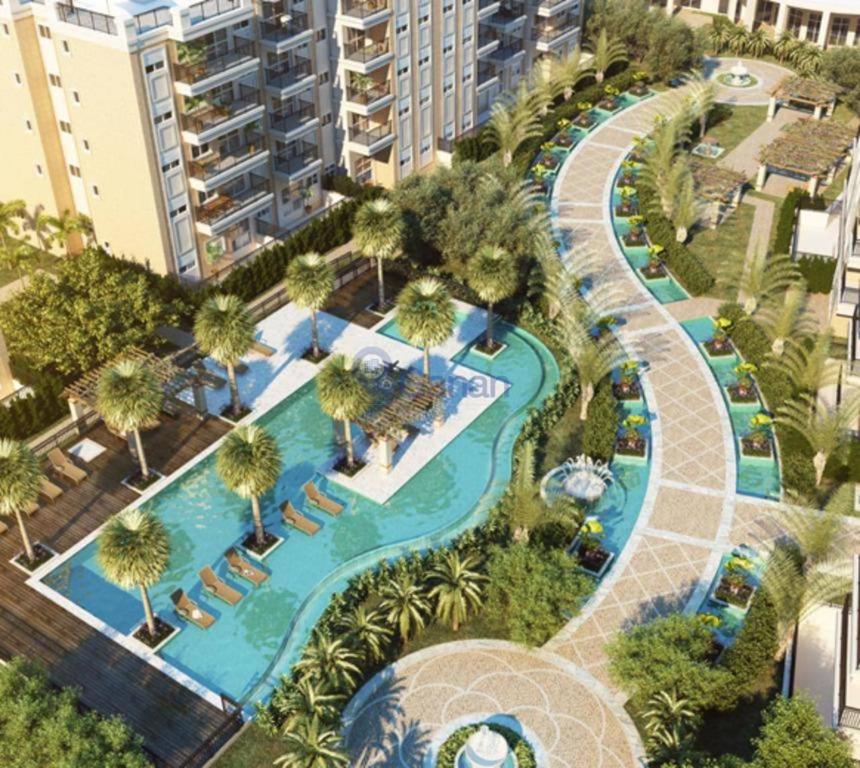 an aerial view of a resort with a pool at Maravilhoso Apartamento inteiro em frente HIAE e Estadio Morumbi in Sao Paulo