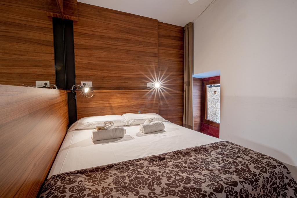 Posteľ alebo postele v izbe v ubytovaní Apartamento 1 en la muralla romana junto a la Catedral