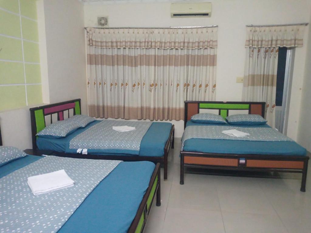 Postel nebo postele na pokoji v ubytování Motel Thanh Huyền