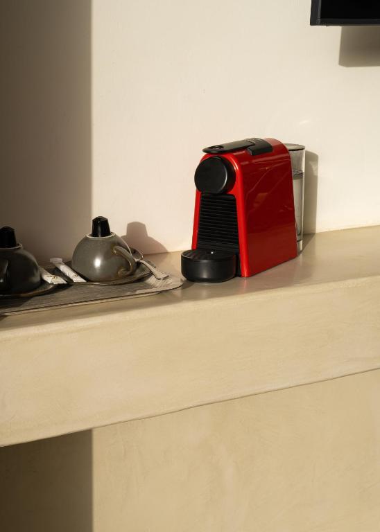 a red toaster sitting on top of a counter at Tulum Beach Resort Dakhla in Dakhla