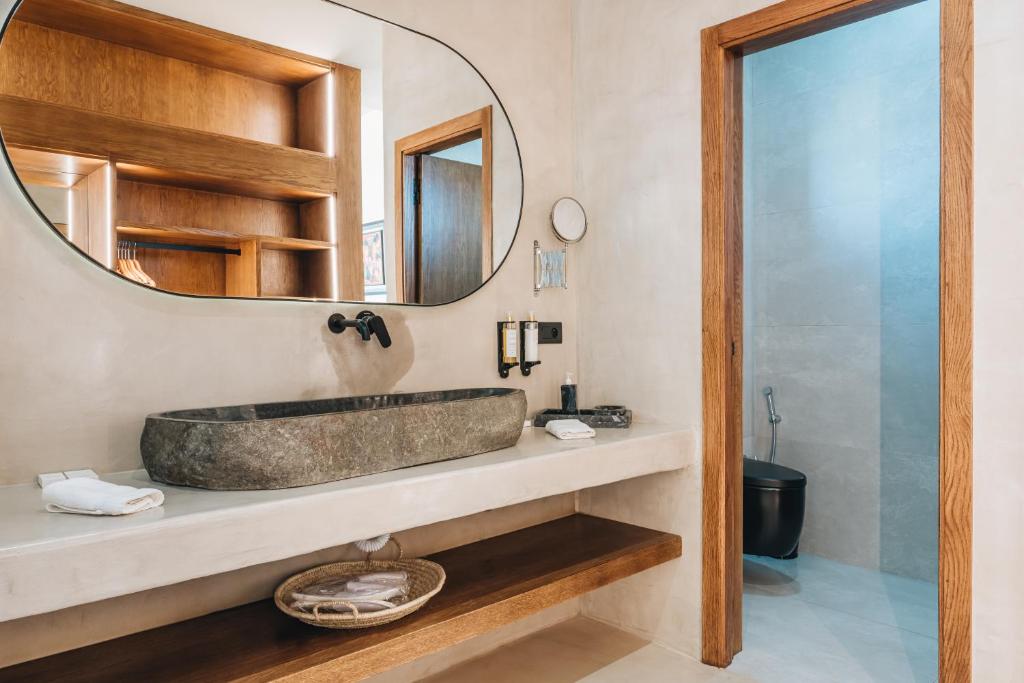 a bathroom with a sink and a mirror at Tulum Beach Resort Dakhla in Dakhla