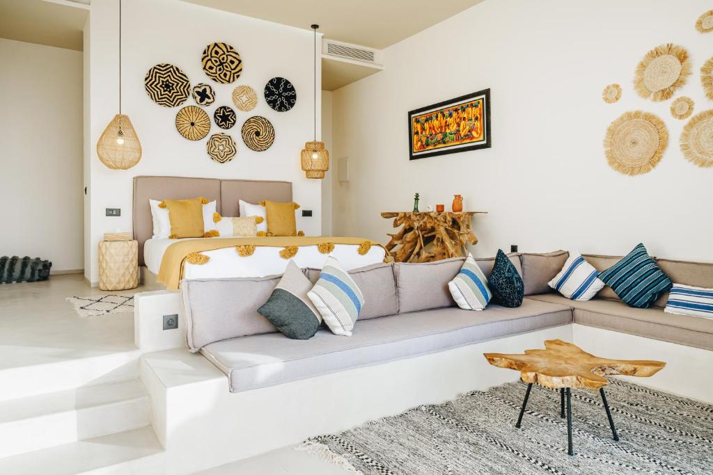 a living room with a couch and a bed at Tulum Beach Resort Dakhla in Dakhla