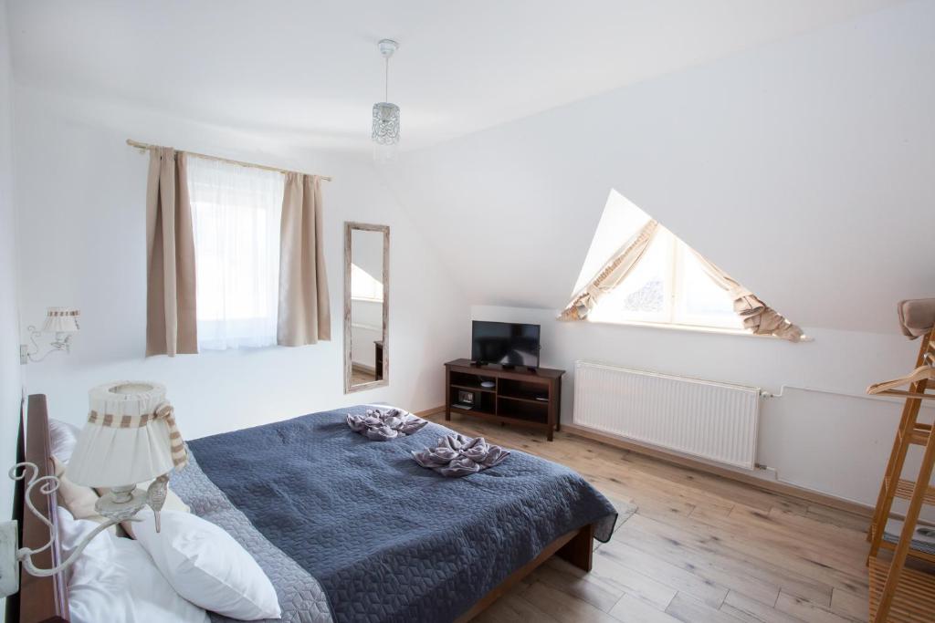 Posteľ alebo postele v izbe v ubytovaní Deres Apartmanház