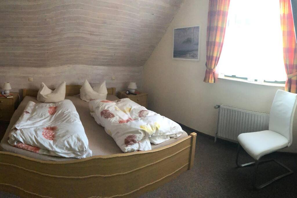 Postel nebo postele na pokoji v ubytování Urlaubsfeeling am Wattnmeer- Ferienhaus Strandmuschel