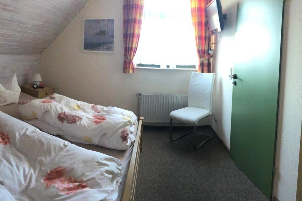Postel nebo postele na pokoji v ubytování Urlaubsfeeling am Wattnmeer- Ferienhaus Strandmuschel