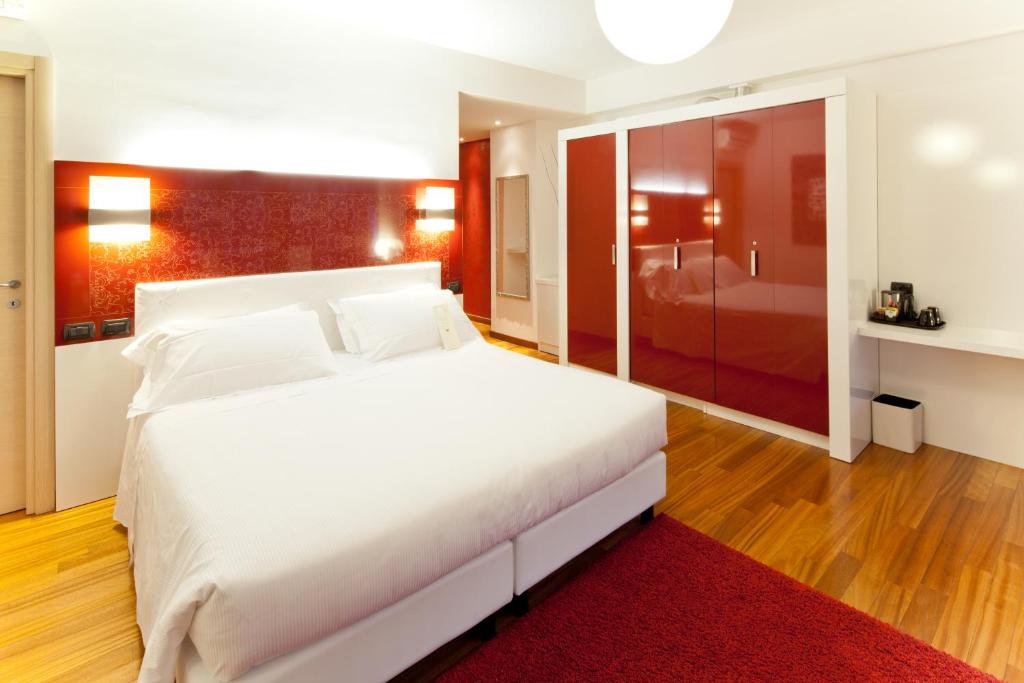 Postel nebo postele na pokoji v ubytování Hotel Nasco
