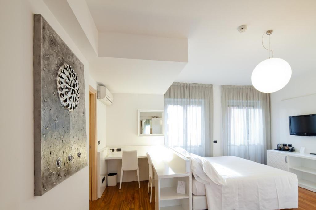 TV a/nebo společenská místnost v ubytování Hotel Nasco