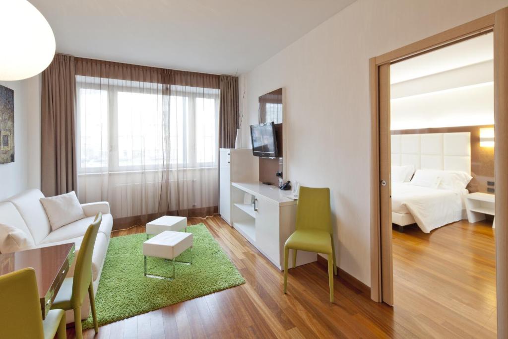 Postel nebo postele na pokoji v ubytování Hotel Nasco