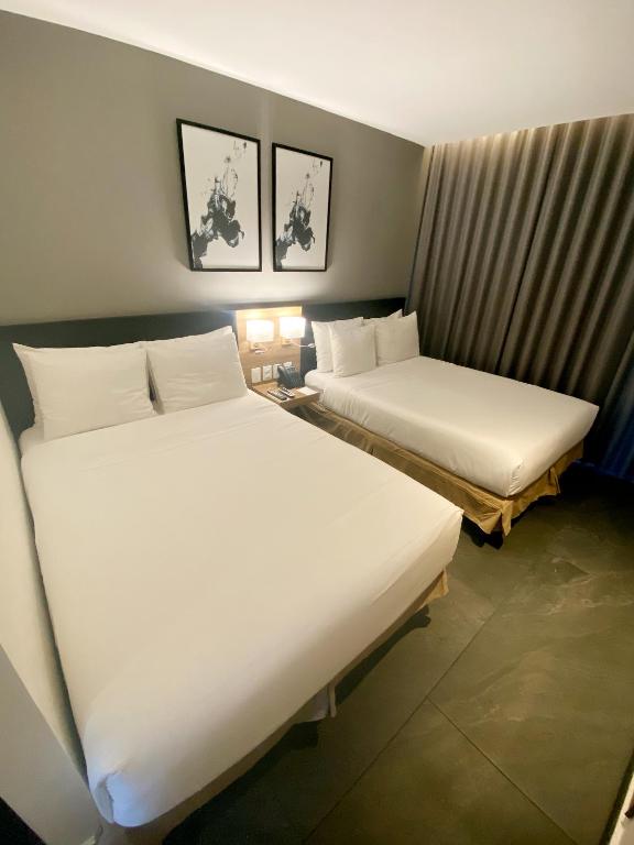 Postel nebo postele na pokoji v ubytování B's Suites Mérida