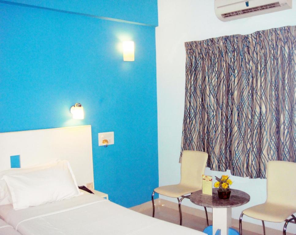 Postel nebo postele na pokoji v ubytování Hotel Pandian