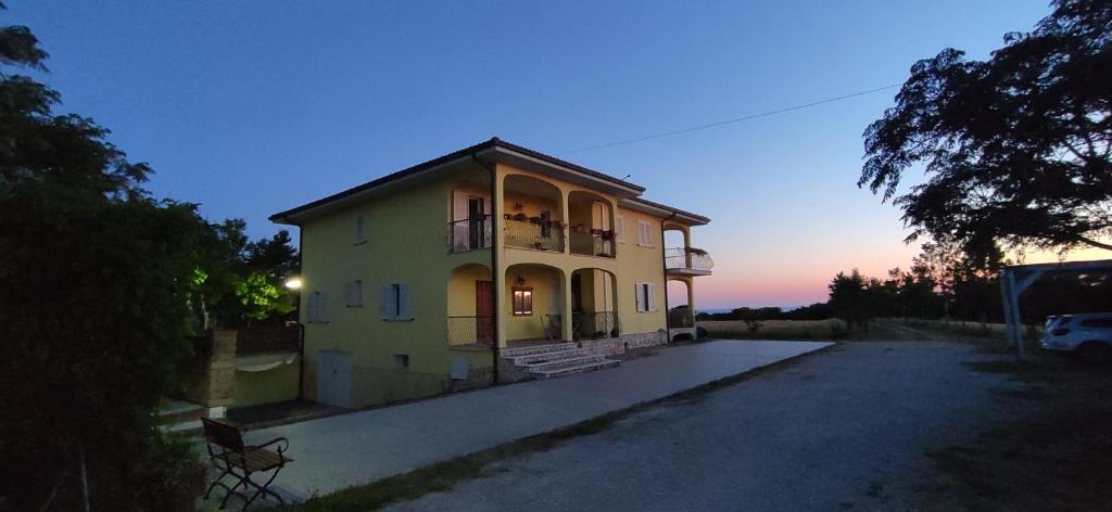 a house with a balcony on top of it at Villa Marianna in Vasto