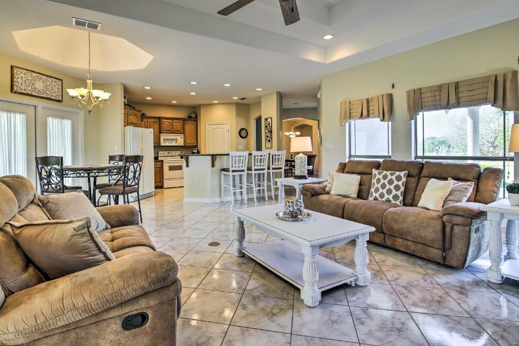 a living room with two couches and a table at Bright Laguna Vista Home with Community Pool! in Laguna Vista